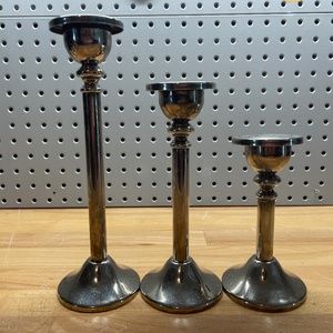 Three Varying Height Silver Colored Candlestick Holders